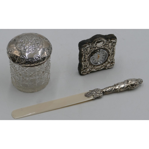 244 - A Chester silver handled paper knife with embossed cupid, floral and scroll decoration with plastic ... 