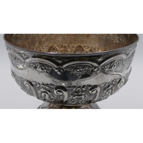 248 - A late Victorian silver punch bowl with allover embossed floral, leaf and scroll decoration, sweepin... 