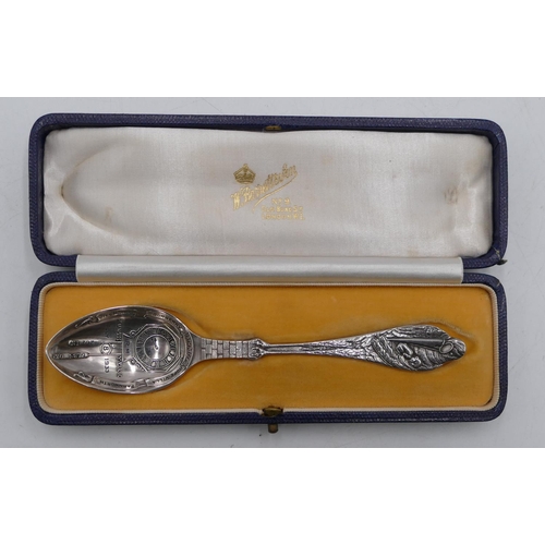 253 - A George V silver child's birth spoon with stalk shaped handle holding a child, bowl engraved with c... 