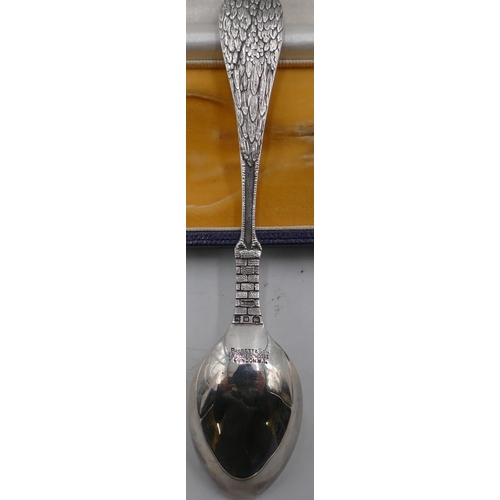 253 - A George V silver child's birth spoon with stalk shaped handle holding a child, bowl engraved with c... 