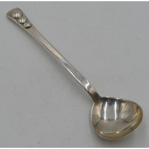 254 - A modern silver serving spoon with raised ball motifs to handle, London 1968, makers mark HDC, 3.6oz... 