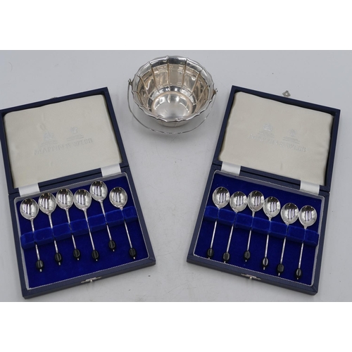 257 - 2 cased sets of 6 coffee bean spoons in fitted blue cases; a silver-plated scallop shaped sugar bask... 