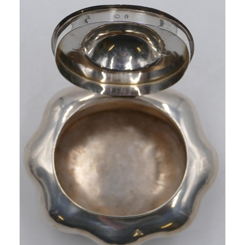 265 - A Birmingham silver bulbous shaped caddy with hinged lid and allover embossed decoration on splayed ... 