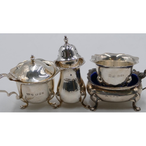 267 - A 3-piece London silver round scallop shaped condiment set on splayed feet and a silver rectangular ... 