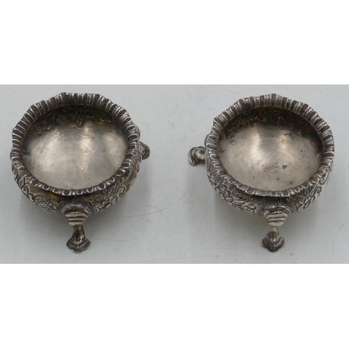 274 - A pair of Birmingham silver round bulbous shaped salts with crinkled rims and allover embossed flora... 