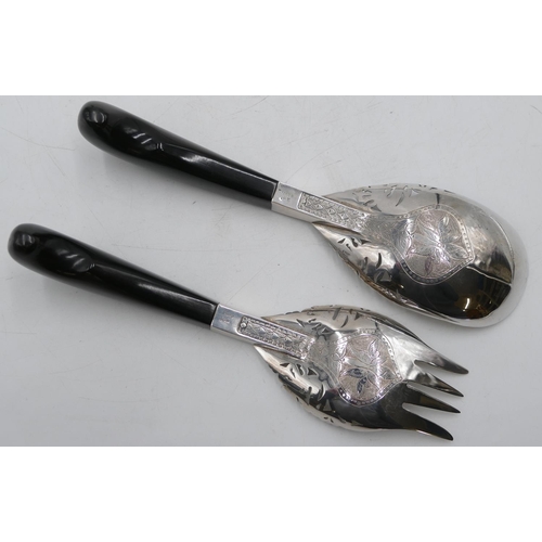 278 - A pair of Siamese silver-coloured metal salad servers with engraved and pierced decoration and ebony... 