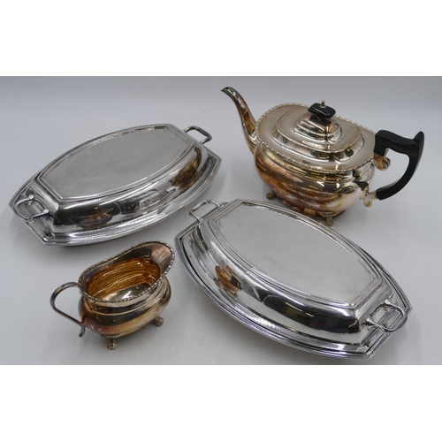 279 - A pair of silver-plated lidded entrée dishes, 29cm long, a plated rectangular bulbous shaped teapot ... 