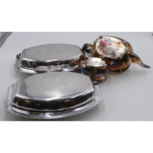 279 - A pair of silver-plated lidded entrée dishes, 29cm long, a plated rectangular bulbous shaped teapot ... 