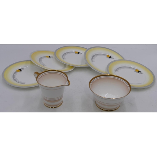 28 - A set of 5 Shelley side plates on white and yellow ground, a Bell china Deco style milk jug and suga... 