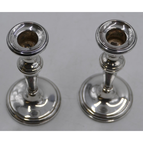 288 - A pair of Birmingham silver dwarf candlesticks on turned stems with round sweeping bases, 13cm high ... 