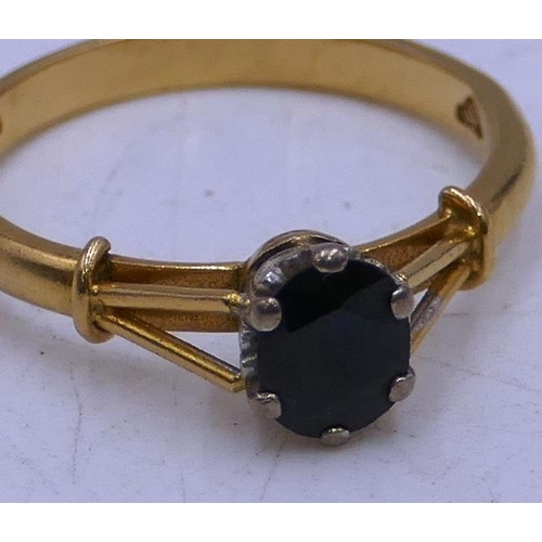 299 - An 18ct gold ladies' ring set with single sapphire, size O/P