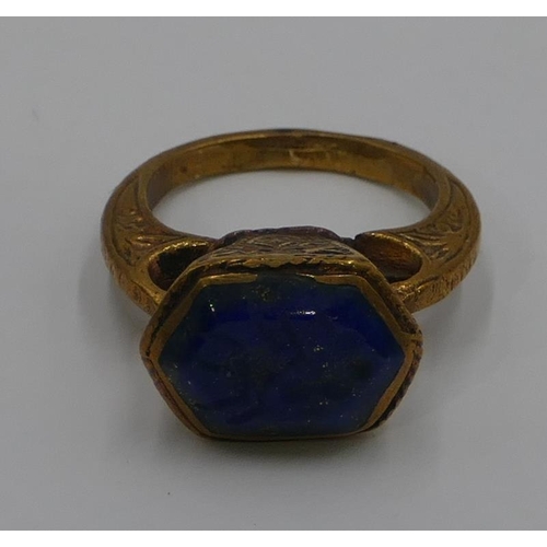 307 - A Roman style gilt ring etched with blue stone and engraved with a scorpion. Size O