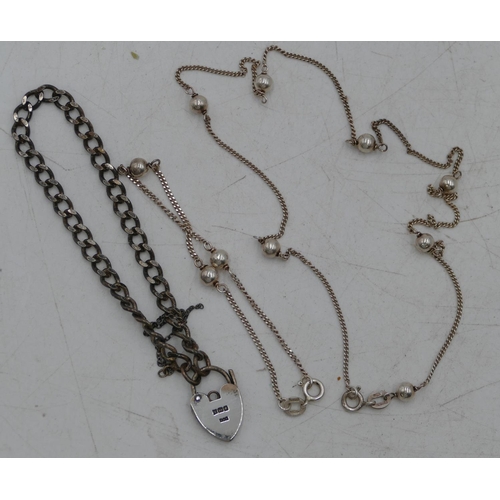 313 - A 925 silver linked and ball chain necklace and a matching bracelet, a silver linked bracelet with p... 