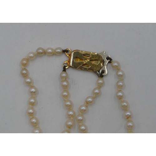 322 - A double row graduated cultured pearl necklace with 9ct gold clasp, 48 cm long.