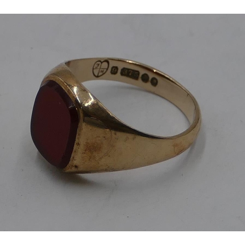 335 - A 9ct gold gentleman's signet ring set with red stone, size M, 2.8 grams gross.