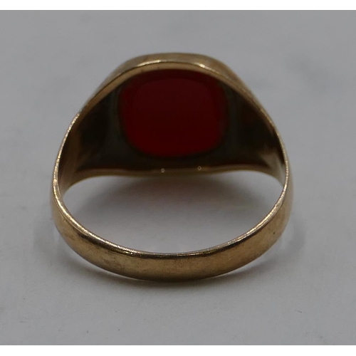 335 - A 9ct gold gentleman's signet ring set with red stone, size M, 2.8 grams gross.