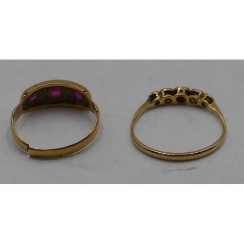 340 - An 18ct gold ladies' ring set with 3 rubies and interspersed by small diamond chips (cut), size L/M ... 