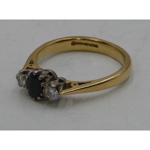 343 - An 18ct gold ladies' ring set with centre sapphire and flanked by 2 diamonds, size Q, 4.7g