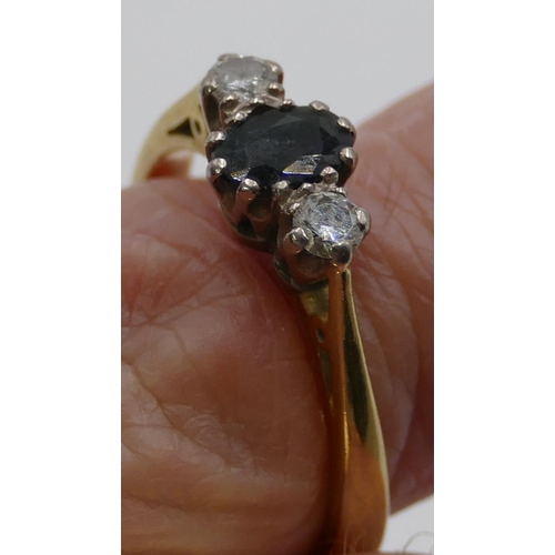 343 - An 18ct gold ladies' ring set with centre sapphire and flanked by 2 diamonds, size Q, 4.7g