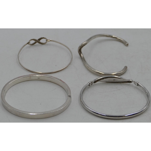 356 - 4 various silver bangles, 84.4 grams. (4)