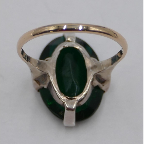 362 - A 9ct gold ladies' cluster ring set with oval green stone, size R.