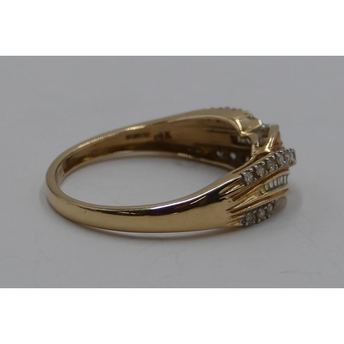 369 - A 9ct gold twist ring mounted with row of small diamonds, size T/U, 3. grams gross.