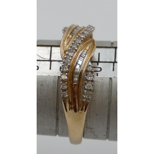 369 - A 9ct gold twist ring mounted with row of small diamonds, size T/U, 3. grams gross.