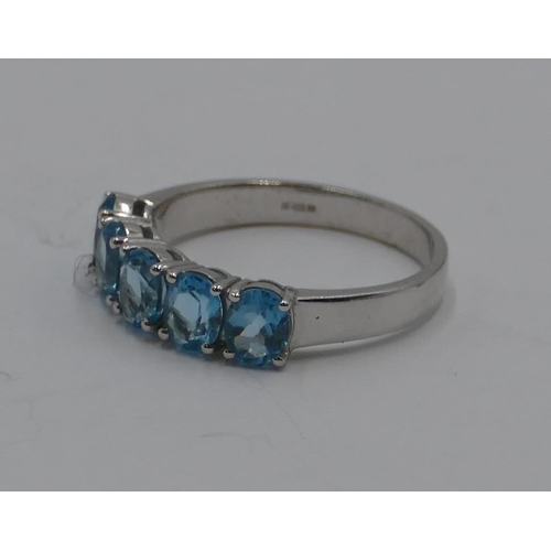 370 - A 9ct gold white gold ladies' 5 stone ring set with pale blue stones, size N/O. 2.7 grams gross.