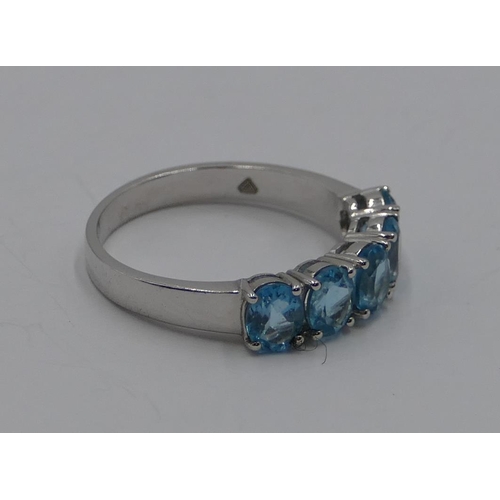 370 - A 9ct gold white gold ladies' 5 stone ring set with pale blue stones, size N/O. 2.7 grams gross.