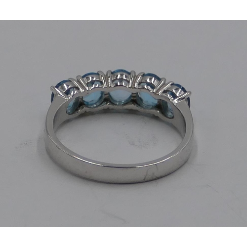 370 - A 9ct gold white gold ladies' 5 stone ring set with pale blue stones, size N/O. 2.7 grams gross.