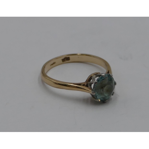 373 - A 9ct gold ladies' ring set with pale blue stone, size N/o, 2.5 grams gross.