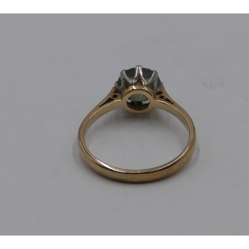 373 - A 9ct gold ladies' ring set with pale blue stone, size N/o, 2.5 grams gross.