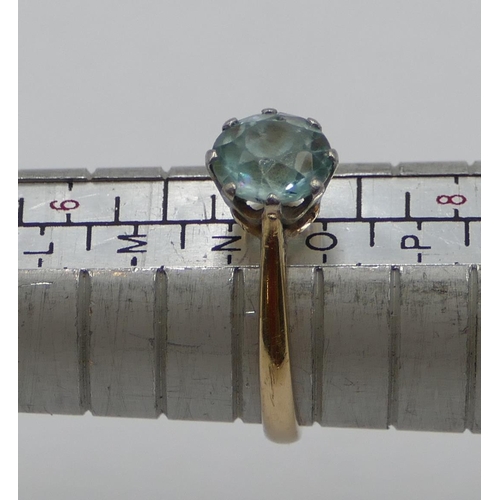 373 - A 9ct gold ladies' ring set with pale blue stone, size N/o, 2.5 grams gross.