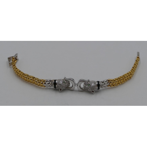 383 - An 18ct white and yellow gold bracelet mounted with 2 leopards heads, inset with allover small diamo... 