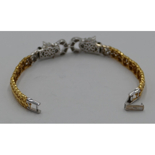 383 - An 18ct white and yellow gold bracelet mounted with 2 leopards heads, inset with allover small diamo... 