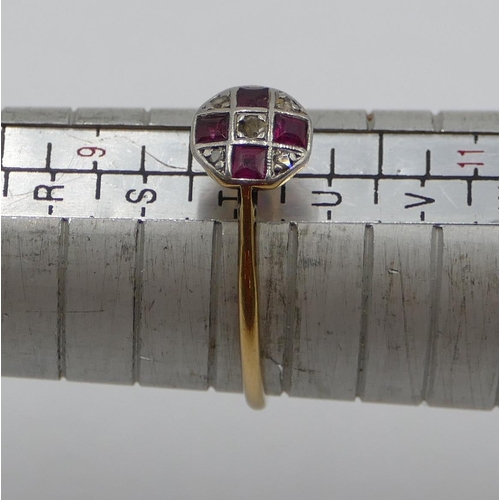 384 - An 18ct gold ladies' small circular ring set with 4 square cut rubies and interspersed with small di... 