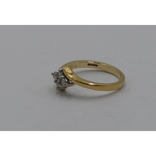 386 - An 18ct gold ladies' twist ring set with 4 diamonds, size Q/R, 5.2 grams gross.