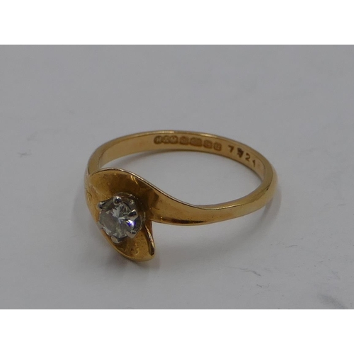 389 - An 18ct gold ladies' solitaire diamond ring with twist ends, size M, 3.3 grams gross.