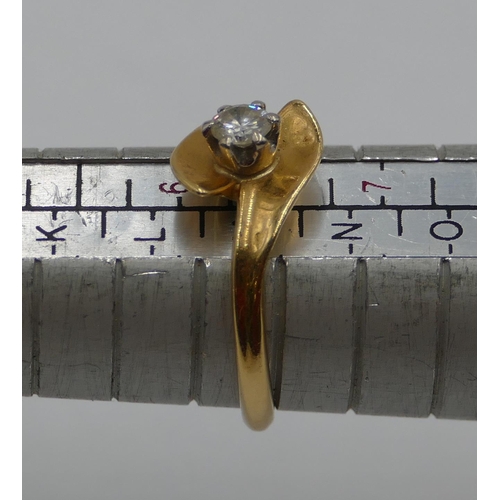 389 - An 18ct gold ladies' solitaire diamond ring with twist ends, size M, 3.3 grams gross.