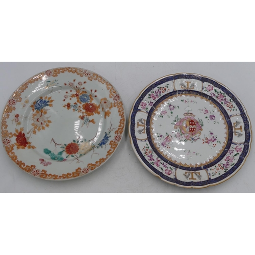 39 - A Japanese 19th Century plate on white ground with multi-coloured vase and branch decoration, 25cm d... 