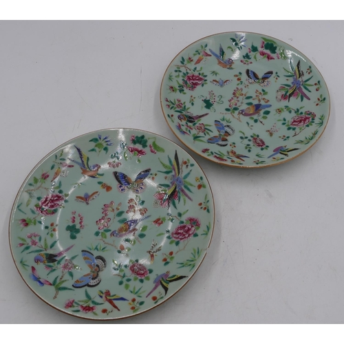 41 - Two 19th Century Cantonese plates on green ground with multi-coloured bird, butterfly, floral and le... 