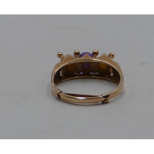 413 - A 9ct gold ladies' ring set with centre purple stone and flanked by 2 pearls, size P, 3.7 grams gros... 