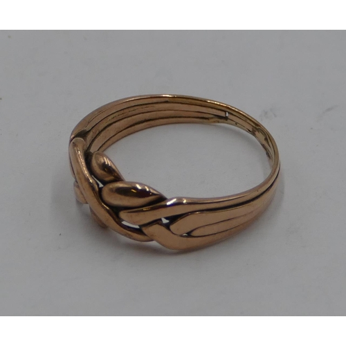 419 - A 9ct gold twist knot shaped ring, size U, 4.1 grams.