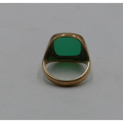 422 - A 9ct gold gentleman's signet ring set with green stone, size S/T, 8.3 grams gross.