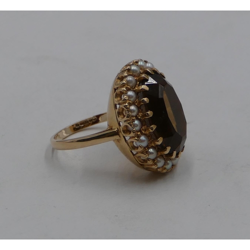 423 - A 9ct gold oval large cluster ring set with centre quartz and surrounded by half pearls, size Q/R, 9... 