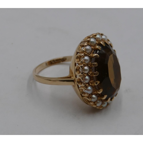 423 - A 9ct gold oval large cluster ring set with centre quartz and surrounded by half pearls, size Q/R, 9... 