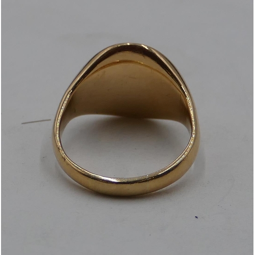 437 - An 18ct gold oval gentleman's signet ring, size O, 9.6 grams.