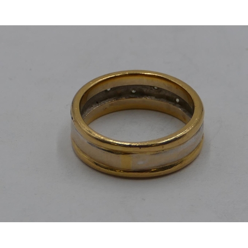 439 - An 18ct 2-coloured gold wedding ring set with 6 small diamonds, size Q/R, 7.9 grams.