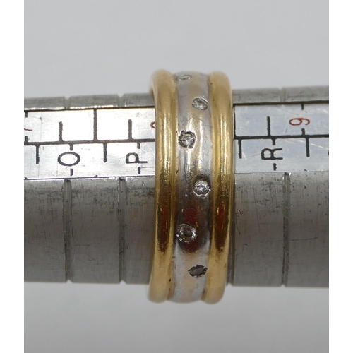 439 - An 18ct 2-coloured gold wedding ring set with 6 small diamonds, size Q/R, 7.9 grams.