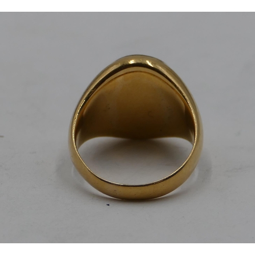 440 - An 18ct gold oval ring set with green intaglio depicting crest, size P, 13.4 grams.